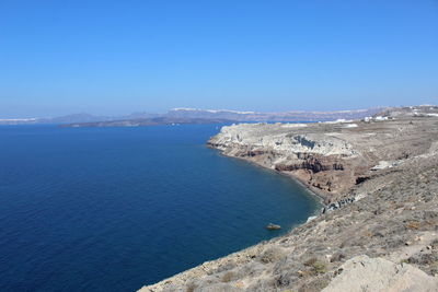 High angle view of sea against clear blue sky