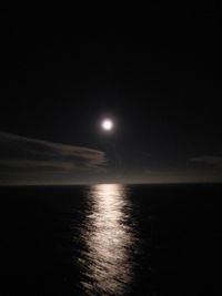 Scenic view of sea against sky at night