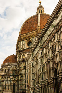 Low angle view of duomo santa maria del fiore against sky in city