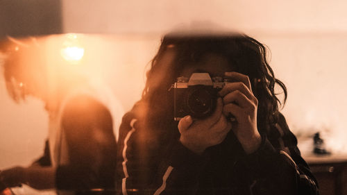 Portrait of woman photographing