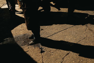 Low section of man standing on floor