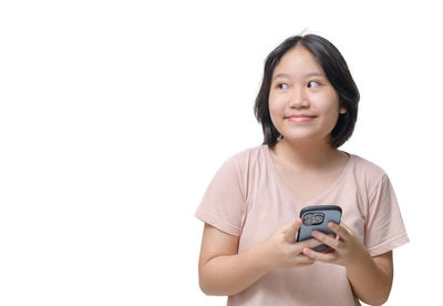 Portrait of young woman against white background