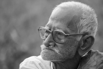 Portrait of man wearing eyeglasses