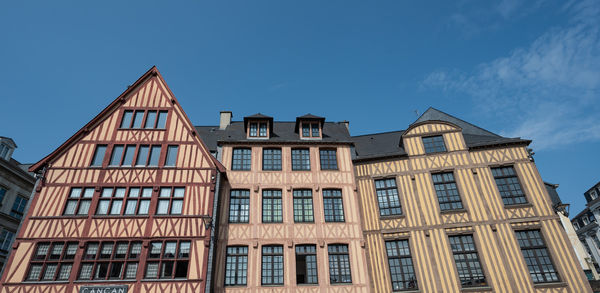 Low angle view of building against clear blue sky