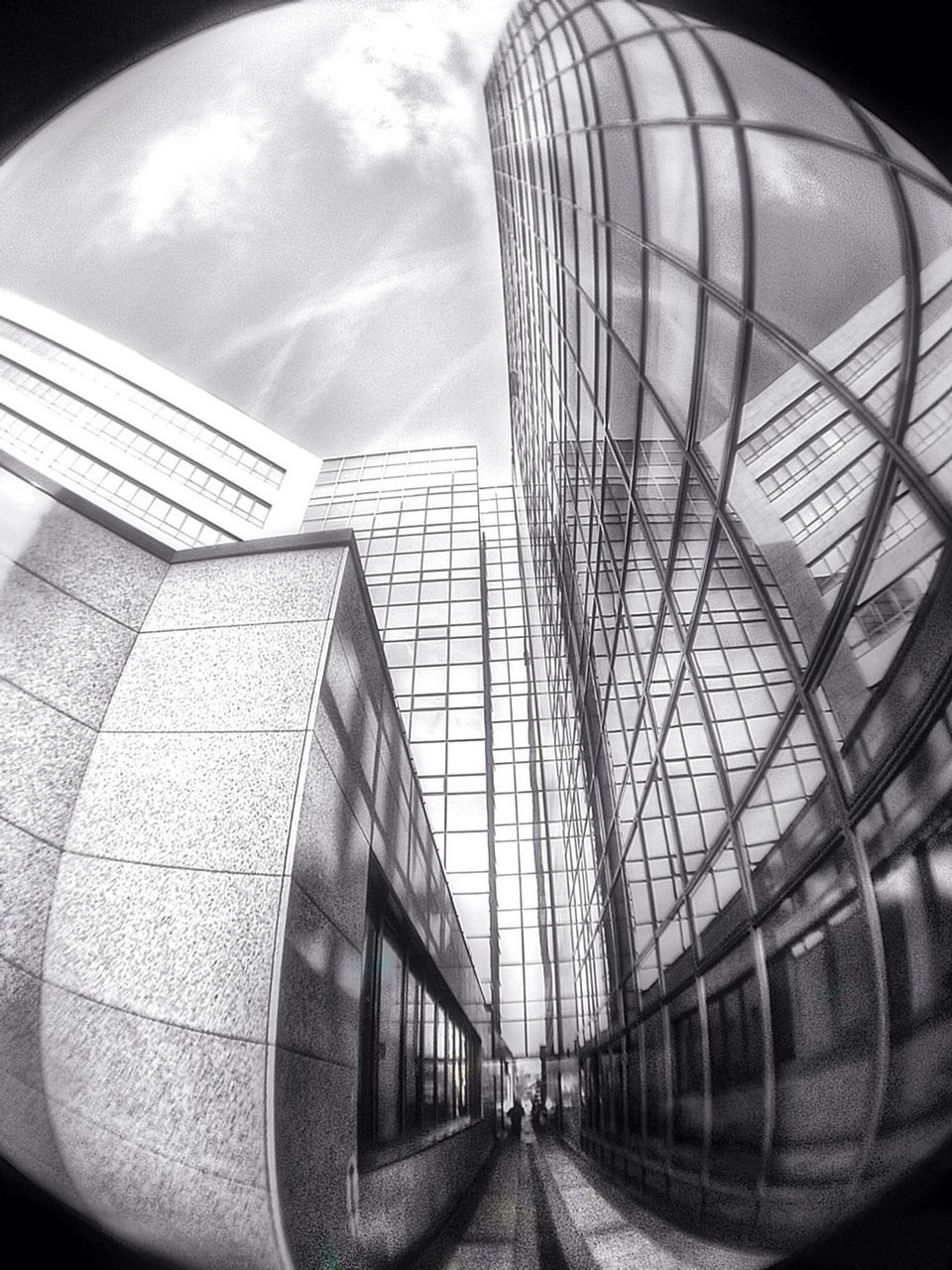 architecture, built structure, building exterior, modern, the way forward, diminishing perspective, transportation, sky, low angle view, glass - material, building, city, indoors, vanishing point, day, no people, pattern, reflection, office building