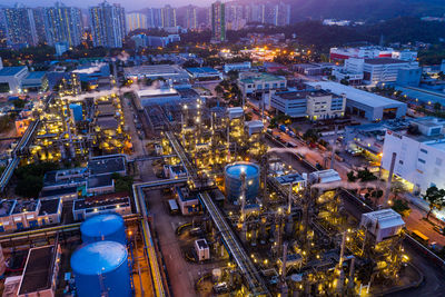 High angle view of illuminated buildings in city at night