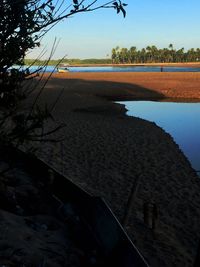 Scenic view of beach against clear sky