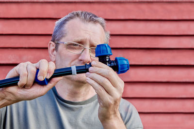 Close-up of man using mobile phone