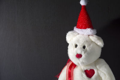 Close-up of stuffed toy against black background