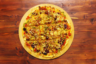 Directly above shot of pizza on wooden table