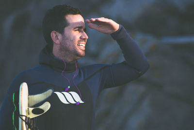 Portrait of young man standing outdoors