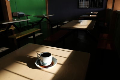 Close-up of empty coffee cup on table