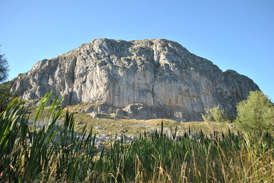 Low angle view of mountain against clear sky