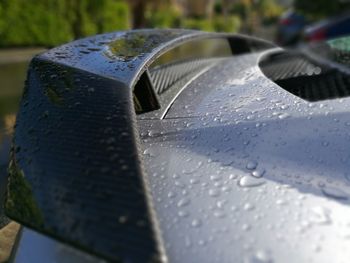 Close-up of rain drop on car