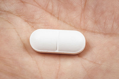 Close-up of hand holding eyeglasses