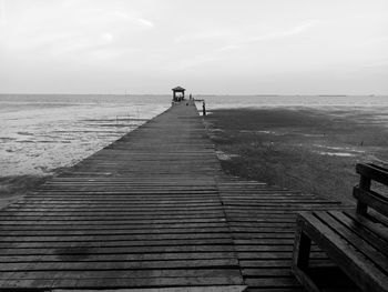 Pier over sea against sky