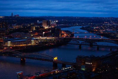 High angle view of illuminated bridge over river at night