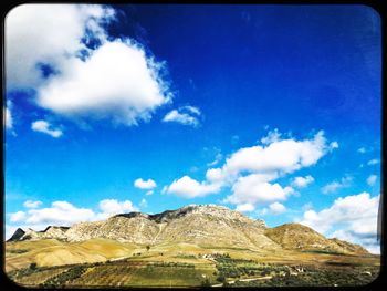 View of mountain range against cloudy sky