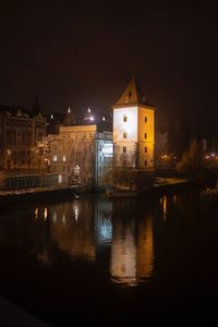Illuminated buildings in city at night