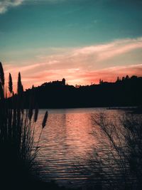 Scenic view of lake against sky during sunset