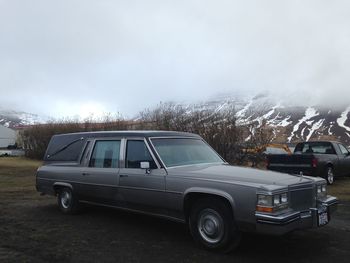 Car on road against sky during winter