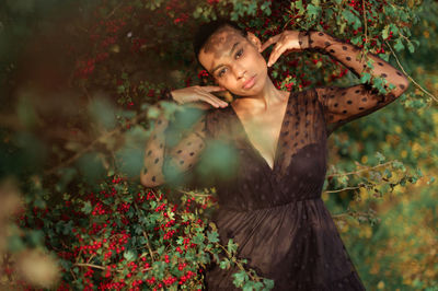 Portrait of girl against plants