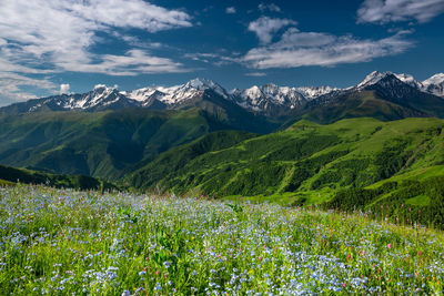 Scenic view of snowcapped mountains against sky