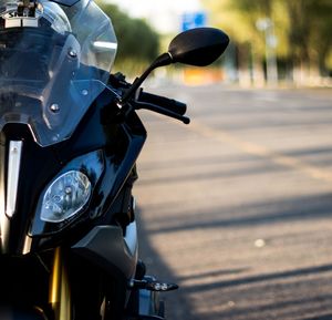 Close-up of bicycle on road