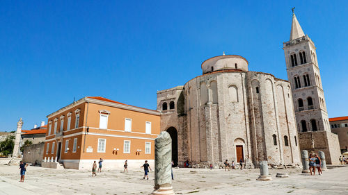View of historical building against clear blue sky