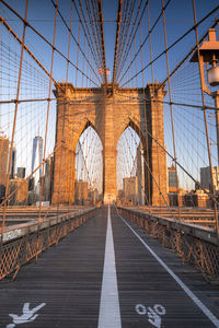 Brooklyn bridge against blue sky