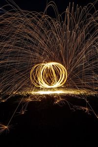 Light painting against sky at night