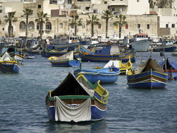 Boats moored at harbor