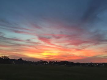 Scenic view of landscape against sky at sunset