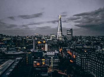 High angle view of city lit up at dusk