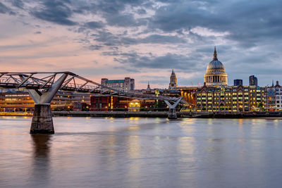 Bridge over river with buildings in background