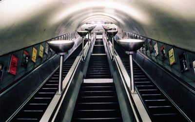 Low angle view of illuminated escalator