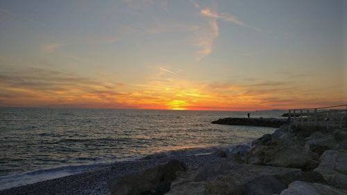 Scenic view of sea against sky during sunset