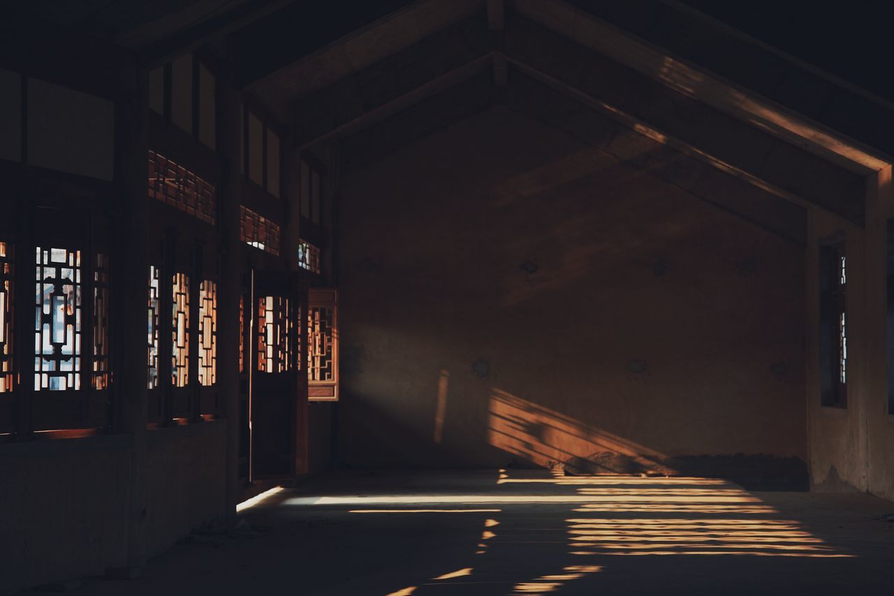 architecture, built structure, illuminated, indoors, night, the way forward, building exterior, empty, building, corridor, shadow, flooring, absence, sunlight, no people, window, lighting equipment, door, dark, entrance