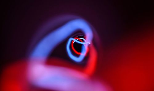 Close-up of red object over black background