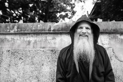 Portrait of smiling man standing outdoors