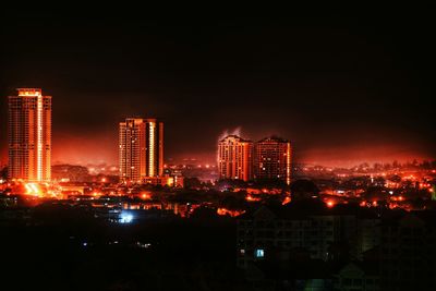 Illuminated cityscape at night