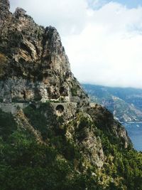 Scenic view of mountains against cloudy sky