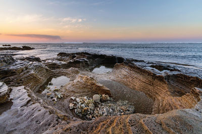 Scenic view of sea against sky during sunset