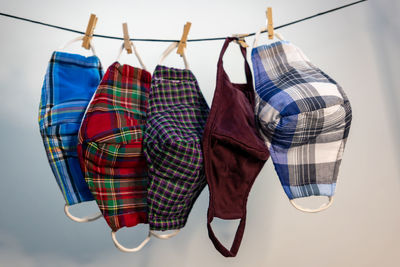 Close-up of multi colored umbrellas hanging on rack