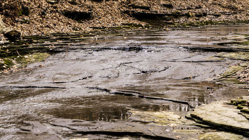 High angle view of water flowing in river