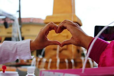 Close-up of couple holding hands