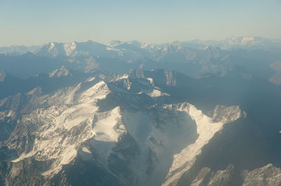 Scenic view of mountains against sky during winter