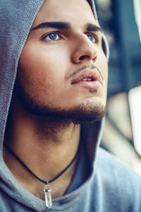 Close-up of young man looking away