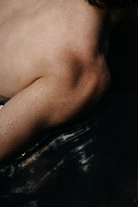 Close-up of shirtless man in water