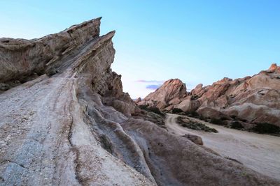 Rock formations in desert against clear sky